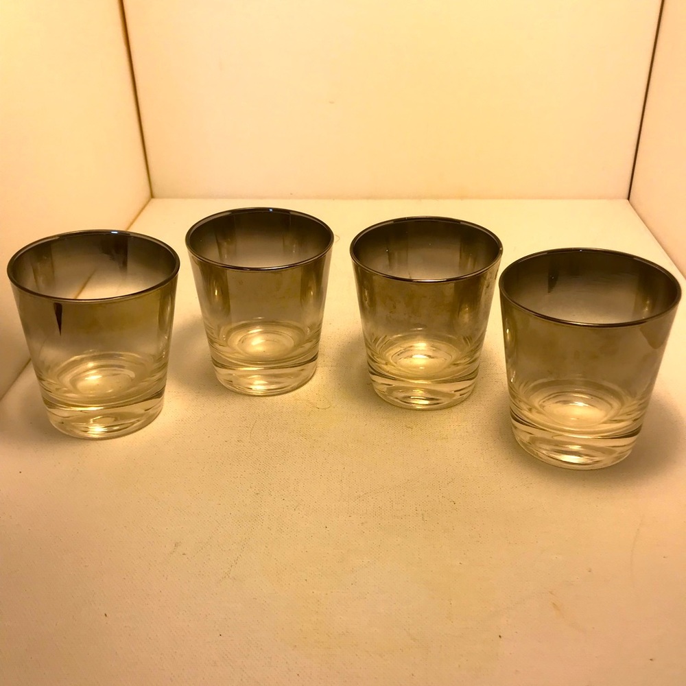 Four small whiskey glasses